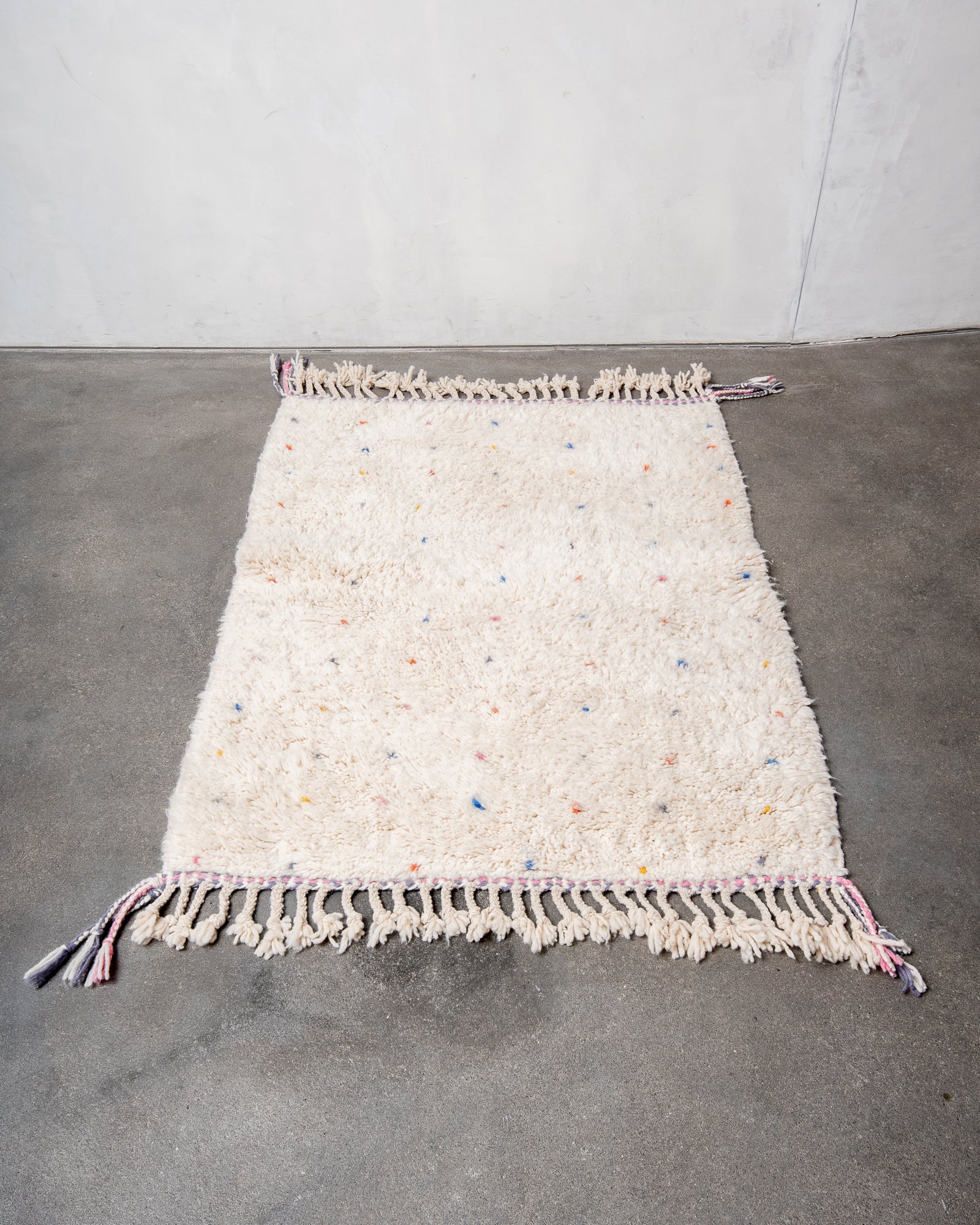 Modern, designer, handcrafted Berber rug from Morocco. Beniourain carpet with beautiful colours and patterns and fluffy wool texture.